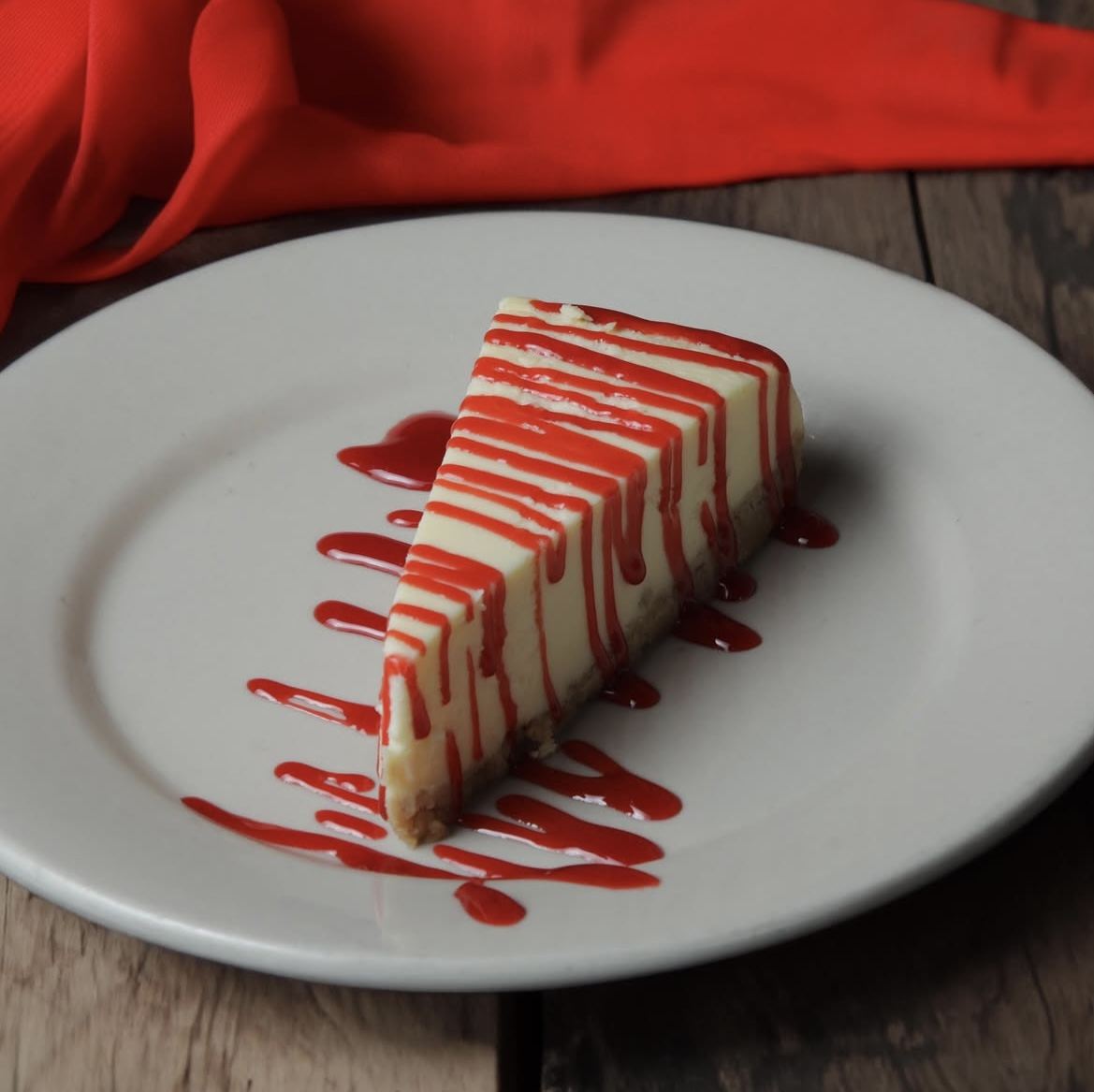 Cheesecake with raspberry drizzle
