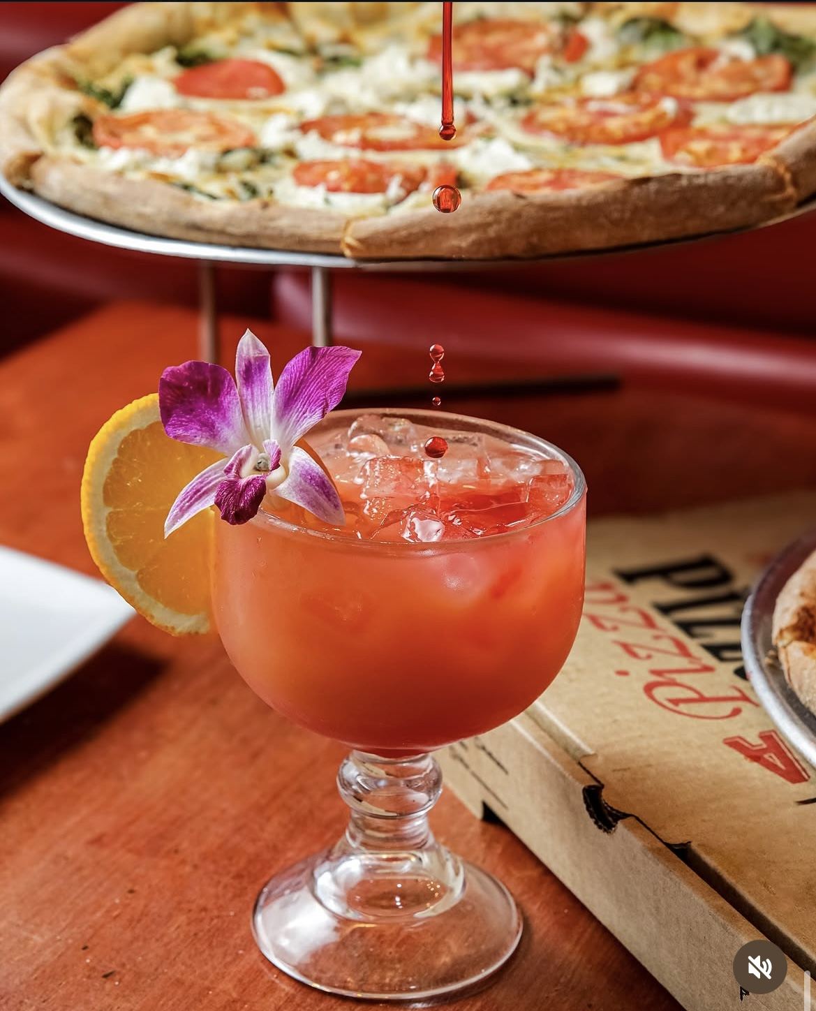 Signature cocktail with pizza